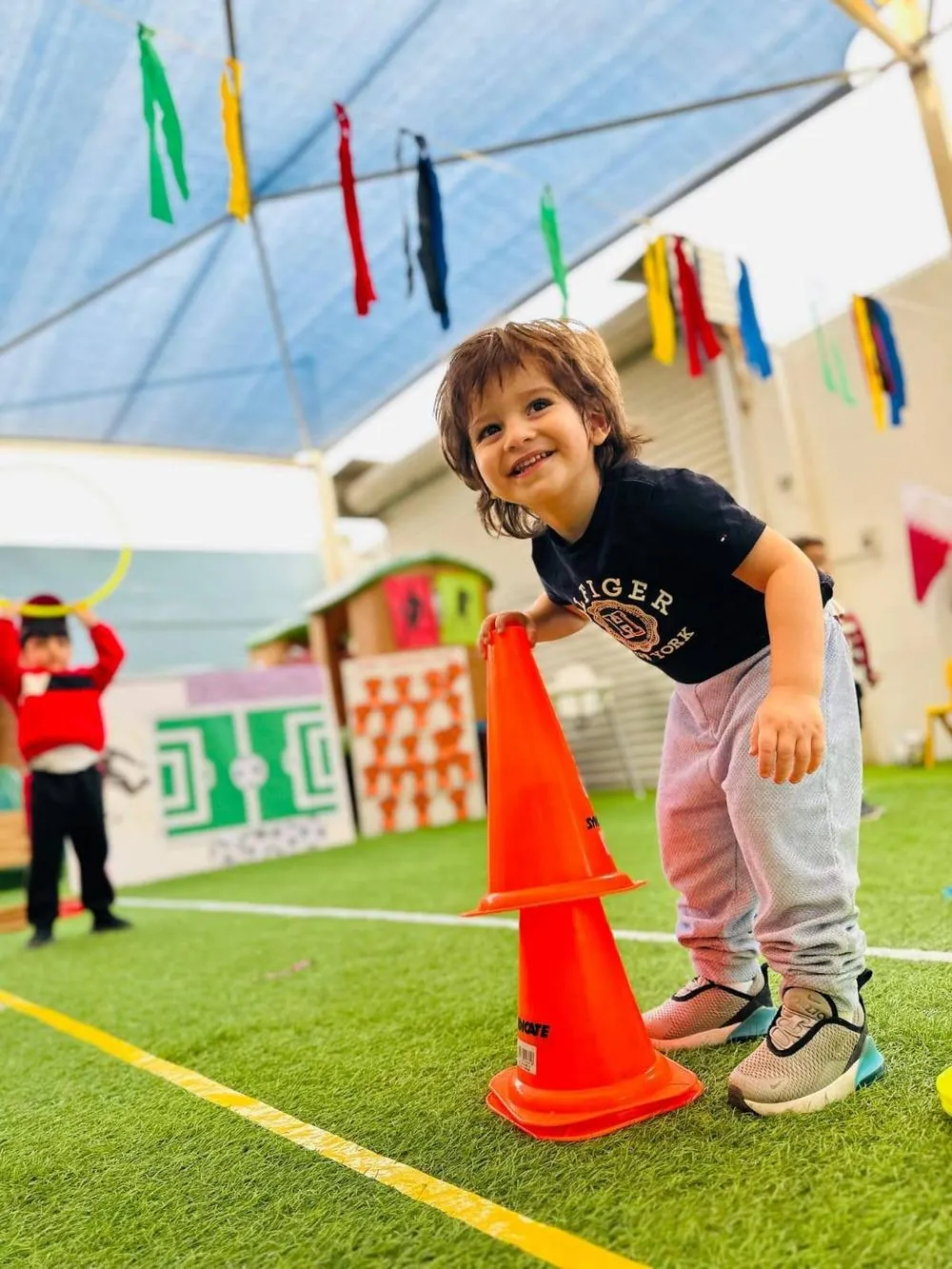 A child playing at the nursery